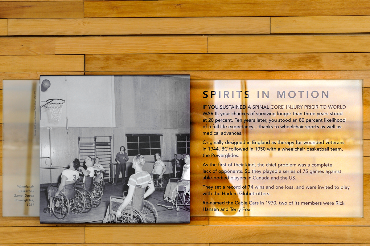 The plaque reads: If you sustained a spinal cord injury prior to World War II, your chances of surviving longer than three years stood at 20%. Ten years later, you stood an 80% likelihood of a full life expectancy, thanks to wheelchair sports as well as medical advances. Originally designed in England as therapy for wounded veterans in 1944, BC followed in 1950 with a wheelchair basketball team, the Powerglides. As the first of their kind, the chief problem was a complete lack of opponents. So they played a series of 75 games against able-bodied players in Canada and the US. They set a record of 74 wins and one loss, and were invited to play with the Harlem Globetrotters. Renamed the Cable Cars in 1970, two of its members were Rick Hansen and Terry Fox.