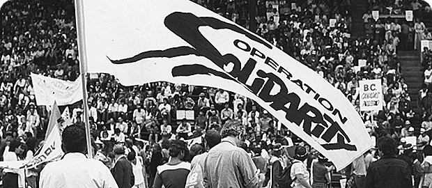 Huge rally with people and a big flat with Operation Solidarity written on it.