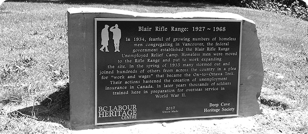 Black and White photo of a plaque in a park