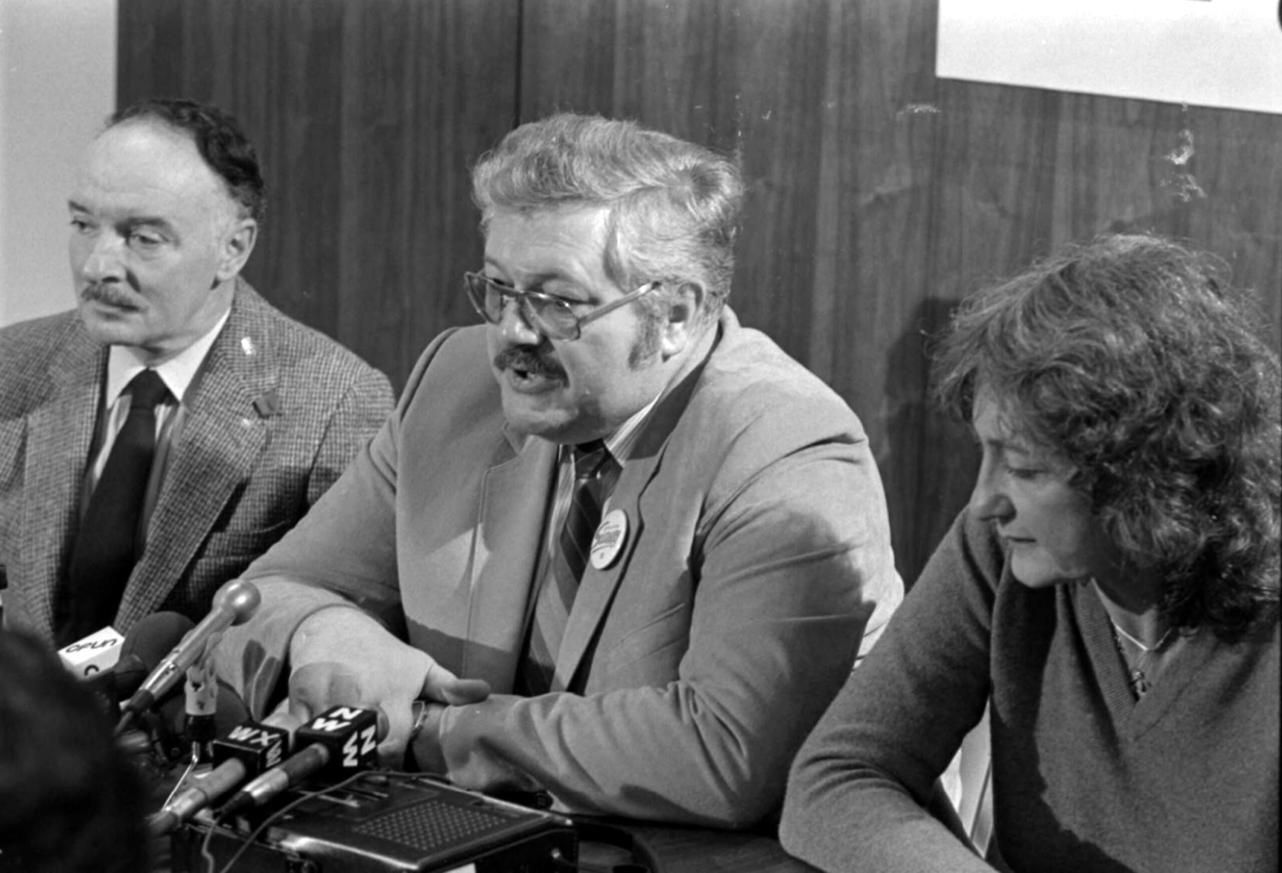 Black and white photo of Art Kube, Renate Shearer, Father Jim Roberts
