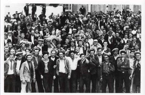 Black and white photo of a large group of men posing for the photo in Regina